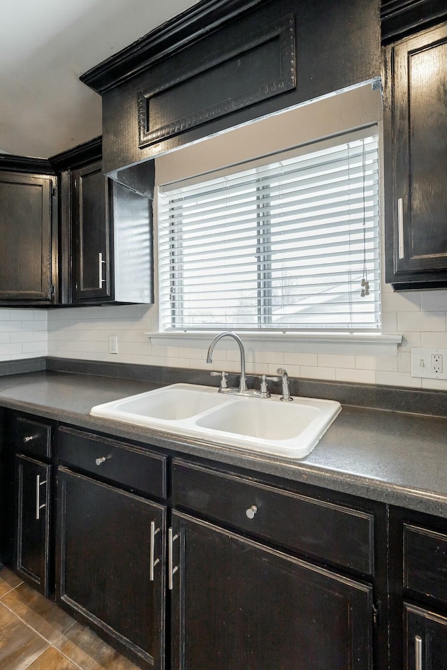 kitchen featuring decorative backsplash and sink