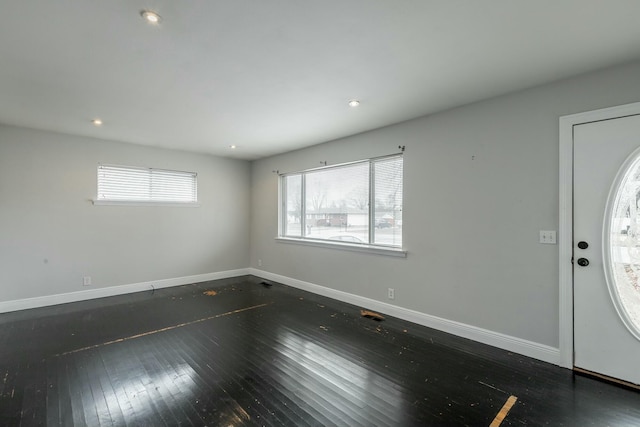 foyer with dark hardwood / wood-style floors