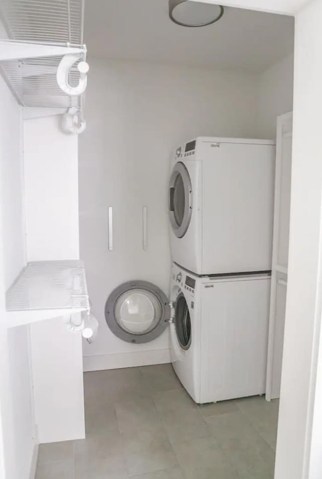 washroom with stacked washer and dryer