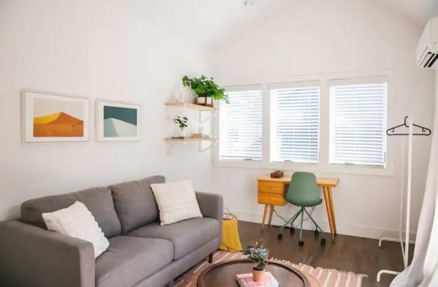 living room with vaulted ceiling, a wall mounted AC, and dark wood-type flooring