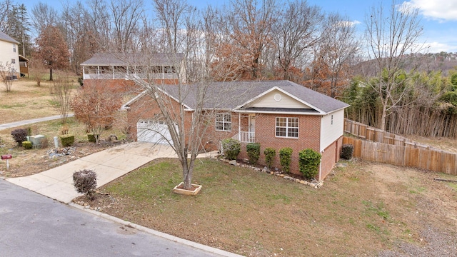 view of front of home with a front lawn and a garage