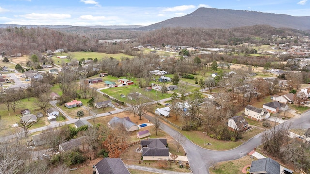 birds eye view of property with a mountain view