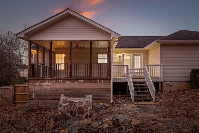 view of back house at dusk