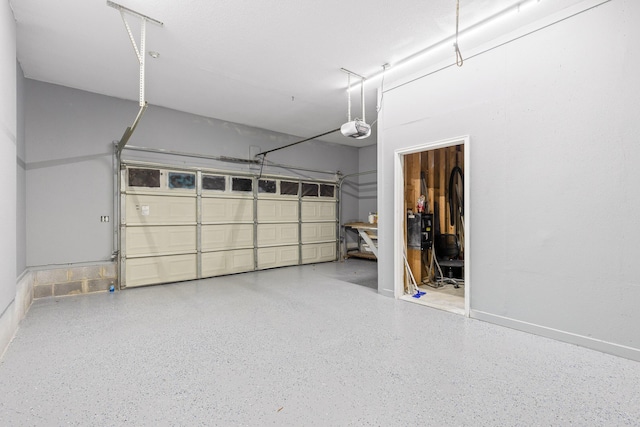 garage featuring a garage door opener