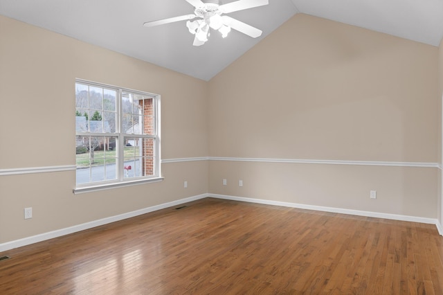 unfurnished room featuring hardwood / wood-style floors, ceiling fan, and vaulted ceiling