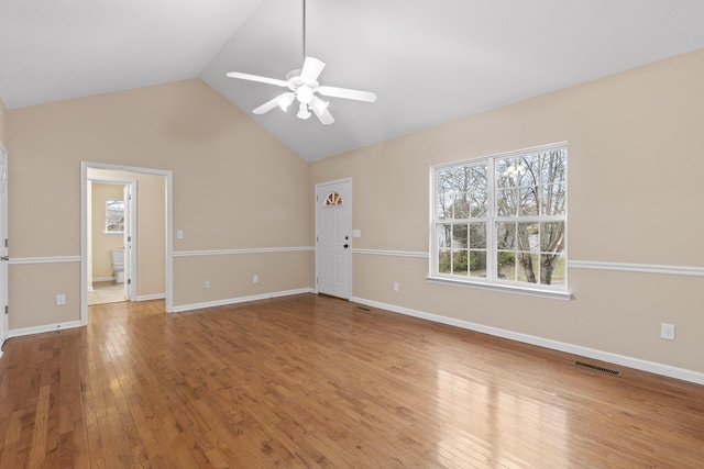 unfurnished living room with hardwood / wood-style flooring, ceiling fan, and lofted ceiling