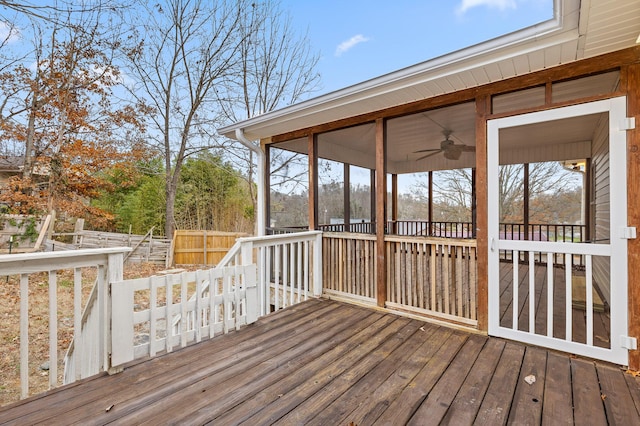 deck featuring a sunroom and ceiling fan