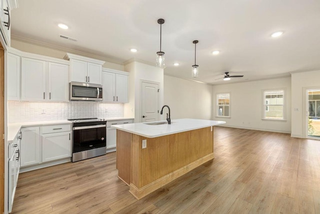 1707 Whisper Winds Ln Unit 33, Ooltewah, TN 37363 - kitchen featuring stainless steel appliances, ceiling fan, backsplash, light countertops, and crown molding