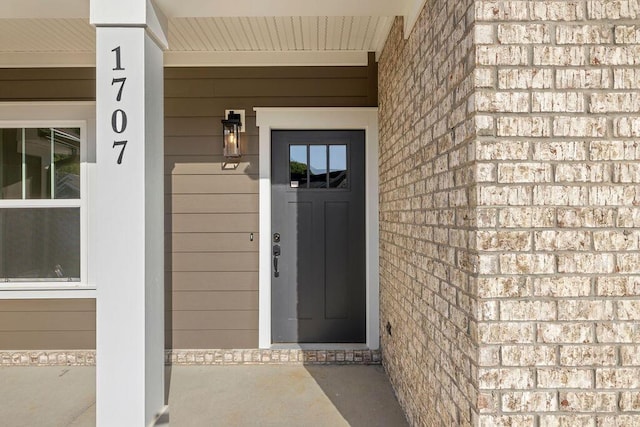 1707 Whisper Winds Ln Unit 33, Ooltewah, TN 37363 - view of exterior entry featuring a porch
