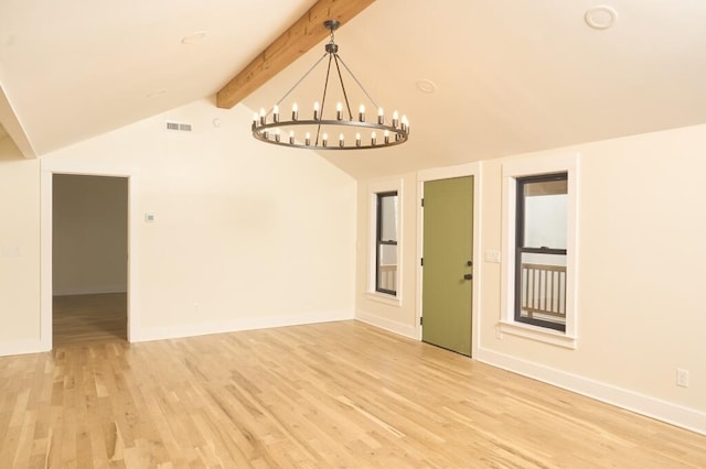 spare room with a notable chandelier, light wood-type flooring, and vaulted ceiling with beams