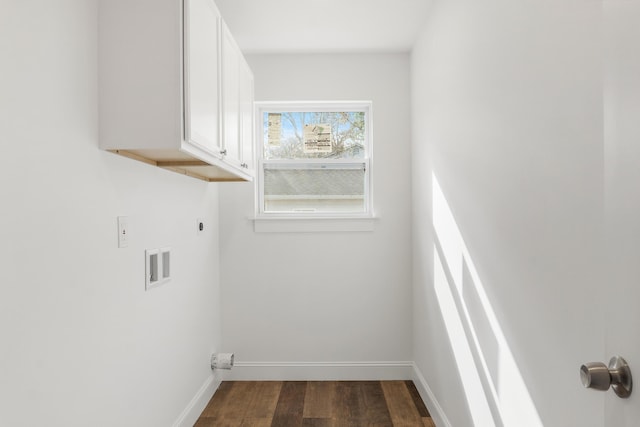 washroom featuring electric dryer hookup, dark hardwood / wood-style floors, cabinets, and hookup for a washing machine