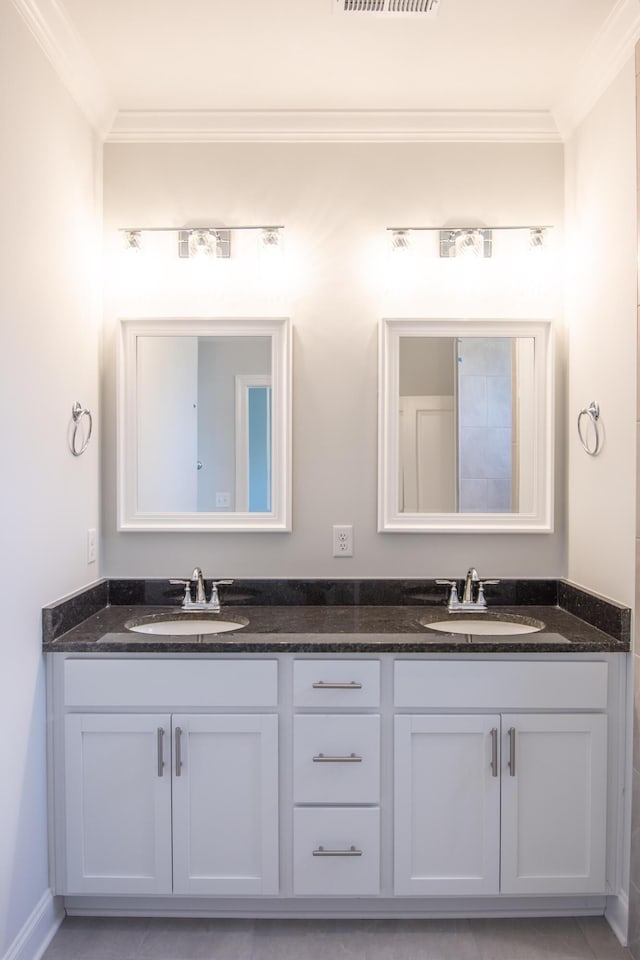 bathroom with vanity and crown molding