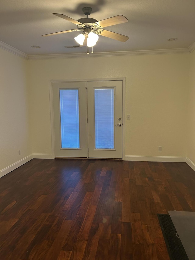 unfurnished room with ceiling fan, crown molding, and dark wood-type flooring