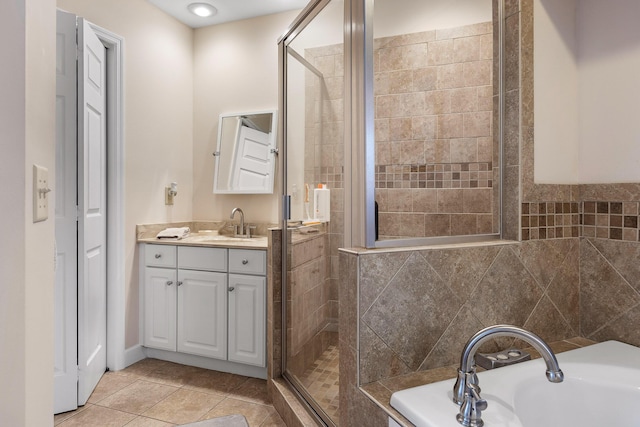 bathroom with tile walls, separate shower and tub, tile patterned flooring, and vanity