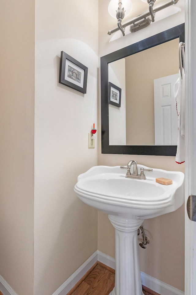 bathroom featuring hardwood / wood-style flooring and sink