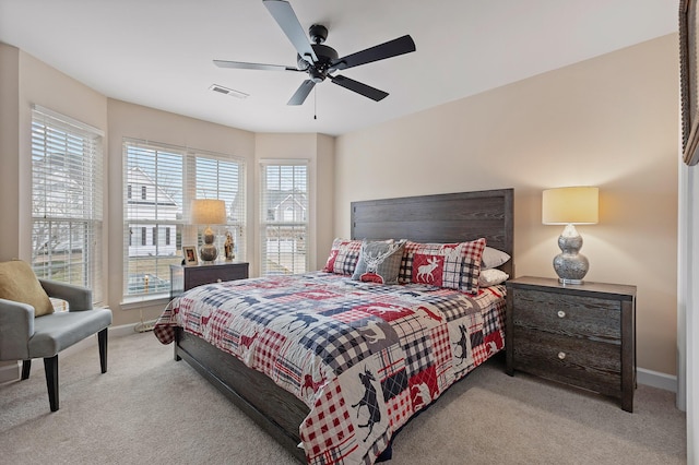 bedroom featuring ceiling fan and light colored carpet