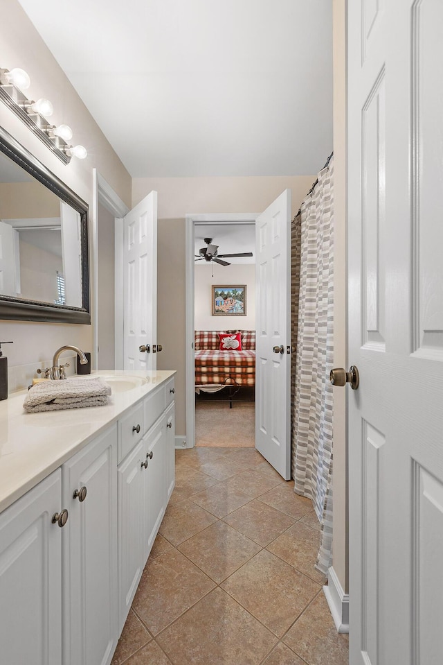 bathroom featuring vanity, tile patterned floors, and ceiling fan