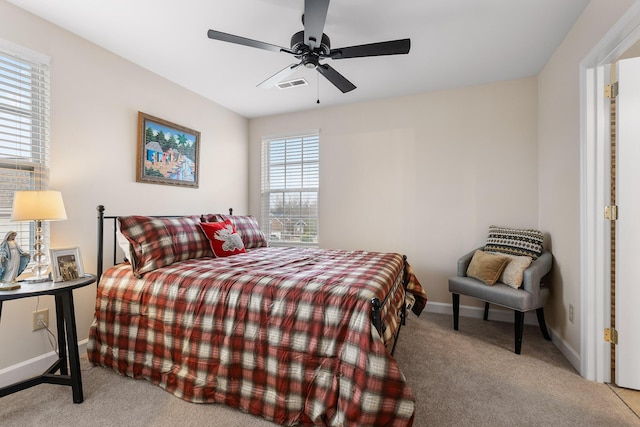 bedroom with light colored carpet and ceiling fan