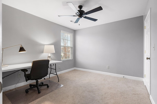 home office with ceiling fan and light colored carpet