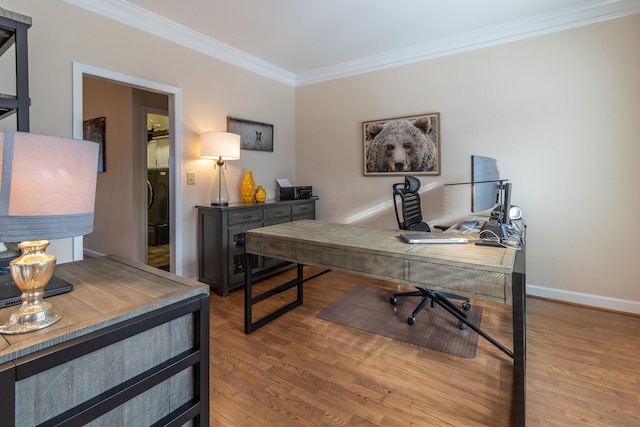 office with hardwood / wood-style floors and ornamental molding