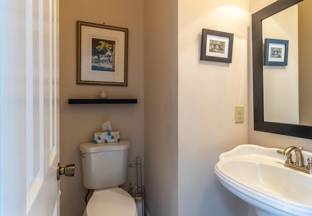 bathroom with sink and toilet