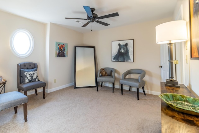 sitting room featuring carpet flooring and ceiling fan