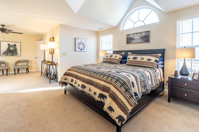 bedroom featuring lofted ceiling, light carpet, and ceiling fan