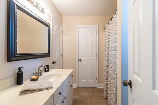 bathroom with vanity and tile patterned floors