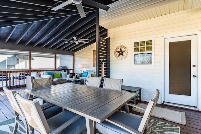 wooden deck featuring ceiling fan and an outdoor living space