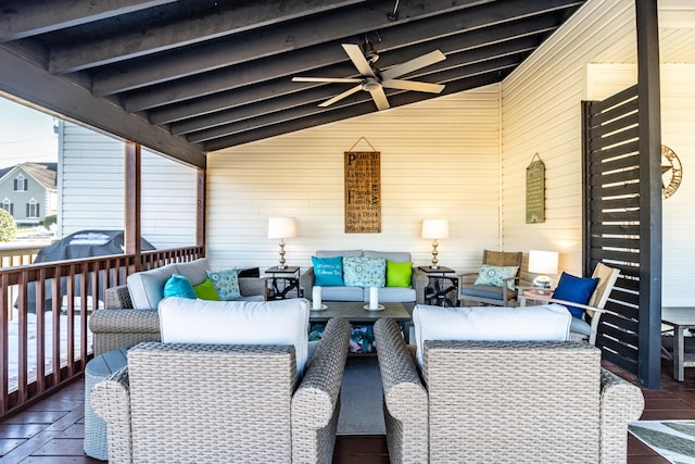 wooden deck featuring ceiling fan and outdoor lounge area