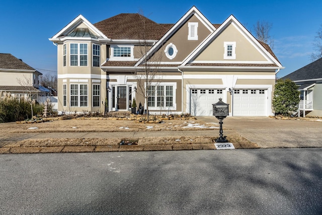 view of front of property with a garage