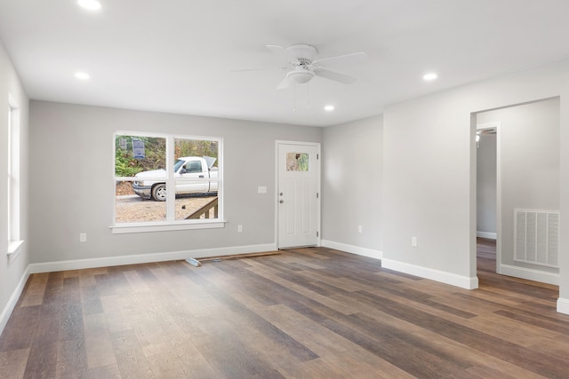 empty room featuring hardwood / wood-style floors and ceiling fan