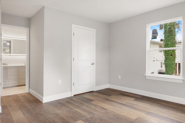 unfurnished bedroom featuring dark hardwood / wood-style floors