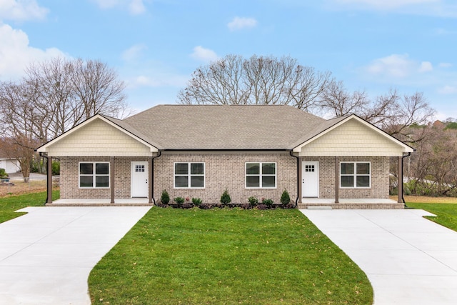 view of front facade with a front yard and a porch