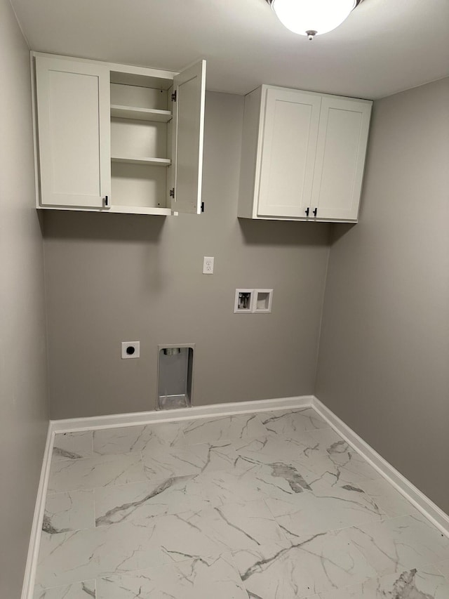 clothes washing area with cabinets, washer hookup, and electric dryer hookup