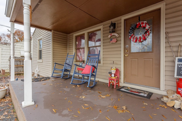 doorway to property featuring covered porch