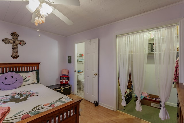 bedroom featuring ceiling fan, light hardwood / wood-style floors, crown molding, and connected bathroom