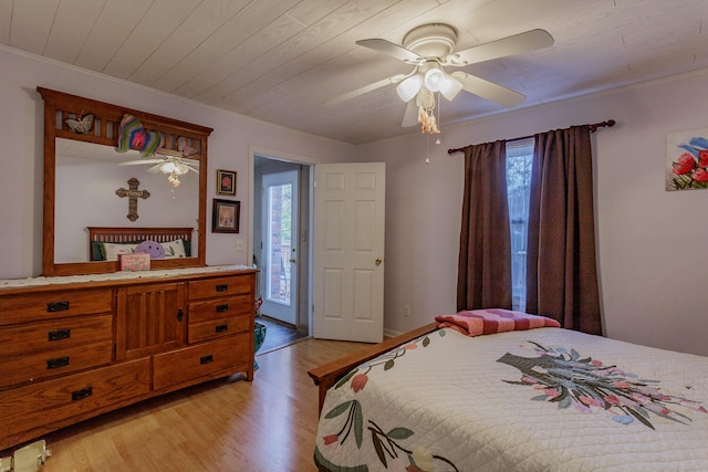 bedroom with multiple windows, ceiling fan, light hardwood / wood-style flooring, and wood ceiling