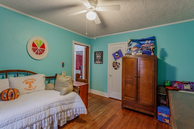 bedroom with ceiling fan, dark hardwood / wood-style flooring, a textured ceiling, and ornamental molding