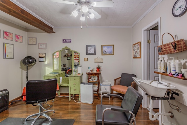 office featuring beam ceiling, dark hardwood / wood-style flooring, ceiling fan, and crown molding