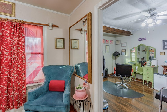 sitting room with hardwood / wood-style flooring, ceiling fan, and ornamental molding