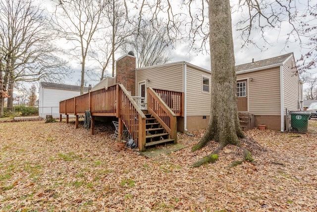 rear view of house featuring a deck