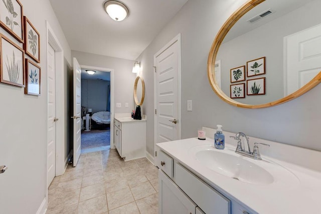 bathroom featuring tile patterned floors and vanity