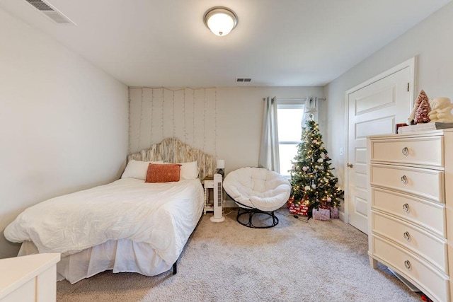 bedroom featuring light colored carpet