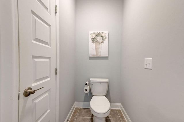 bathroom featuring tile patterned floors and toilet