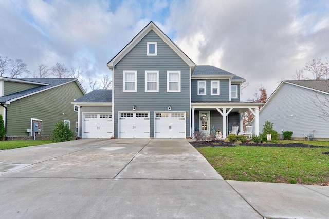 view of front of property with a front lawn and a garage