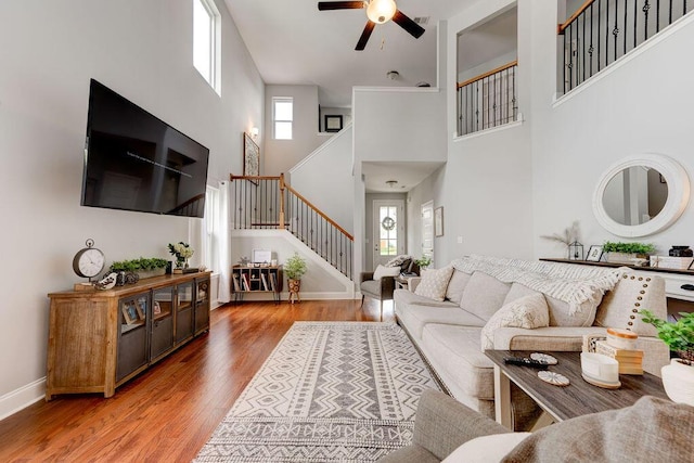 1494 Buttonwood, Chattanooga, TN 37421 - living room with stairway, a high ceiling, a ceiling fan, light wood finished floors, and baseboards