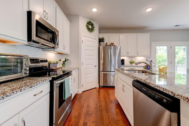 1494 Buttonwood, Chattanooga, TN 37421 - kitchen with appliances with stainless steel finishes, a sink, backsplash, white cabinetry, and recessed lighting