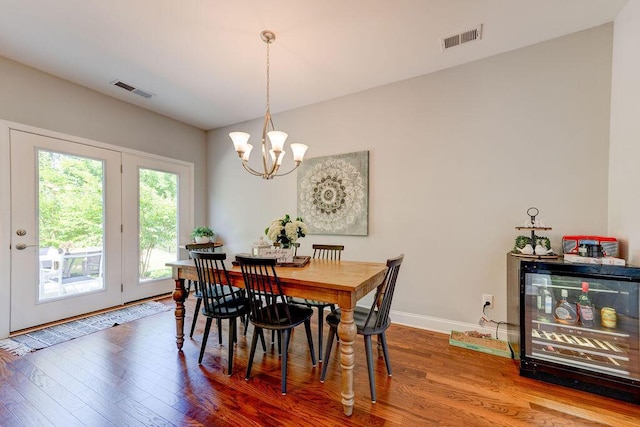 1494 Buttonwood, Chattanooga, TN 37421 - dining area featuring wood finished floors, a chandelier, beverage cooler, and baseboards