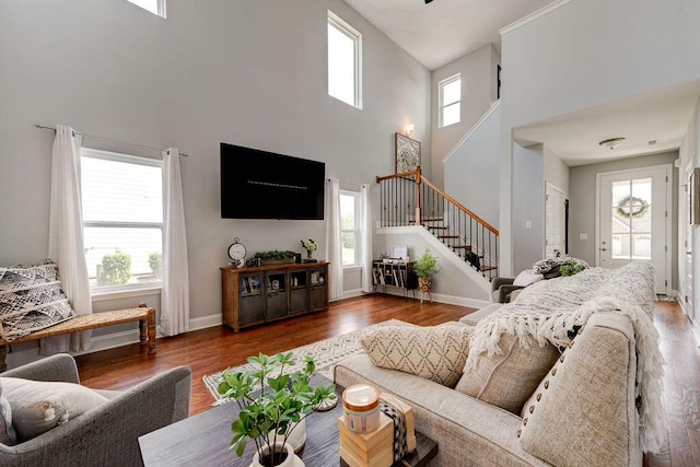 1494 Buttonwood, Chattanooga, TN 37421 - living area featuring stairs, a high ceiling, healthy amount of natural light, and wood finished floors